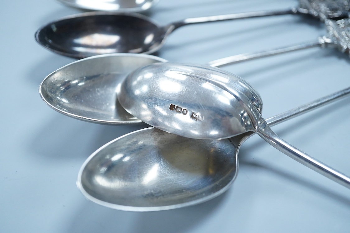 A matched set of seven early 20th century silver spoons, with rat-tail bowls, the terminals modelled as the crest of the Worshipful Company of Joiners and Ceilers, various dates and makers including Mappin & Webb and Elk